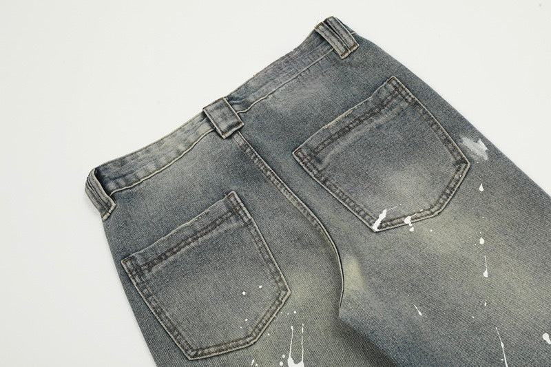 Lackierte Schlagjeans