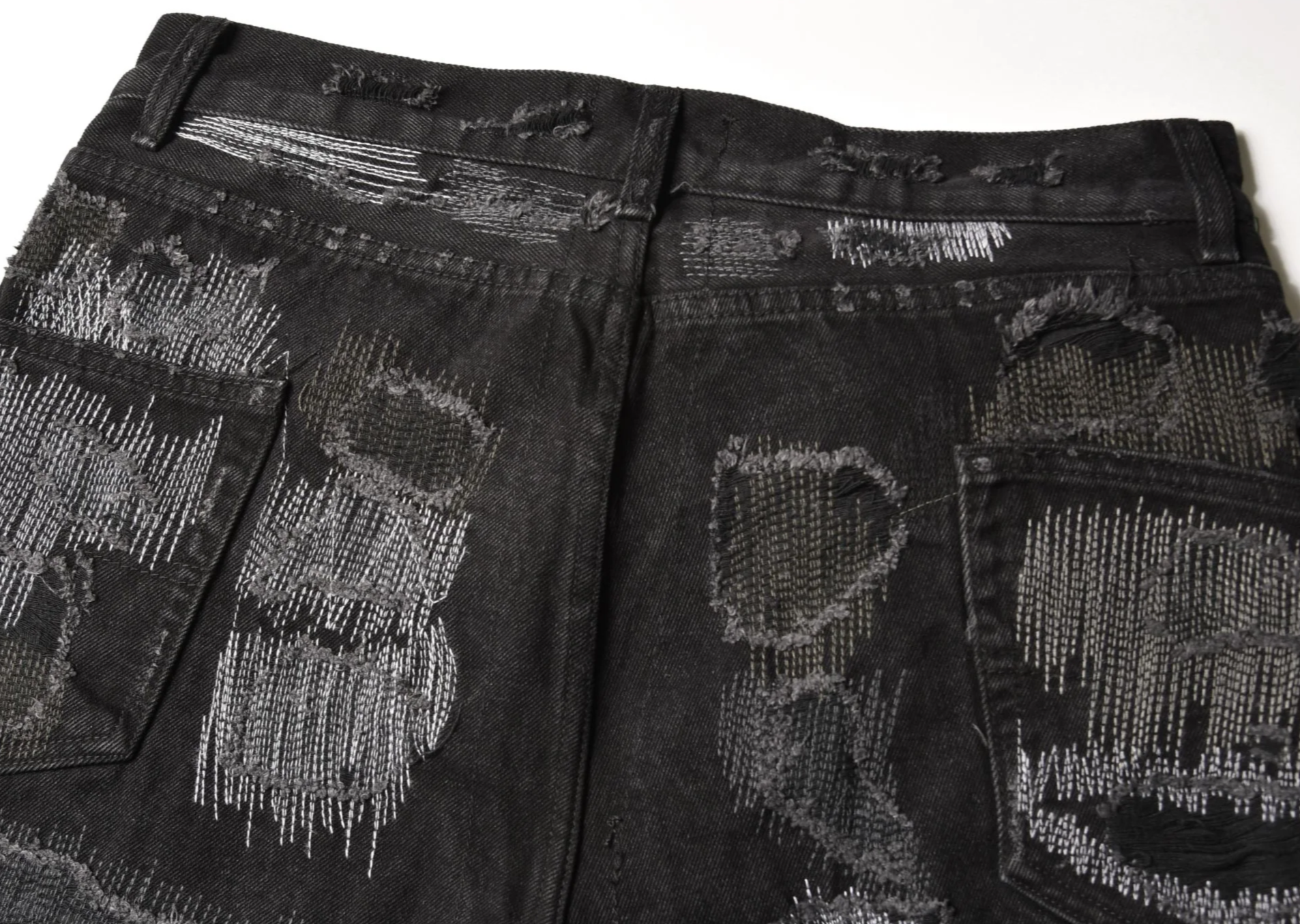 Schwarze Distressed Jeans