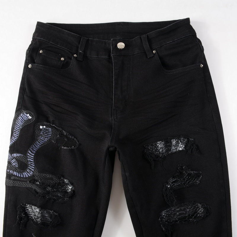 Schwarze Schlangenjeans
